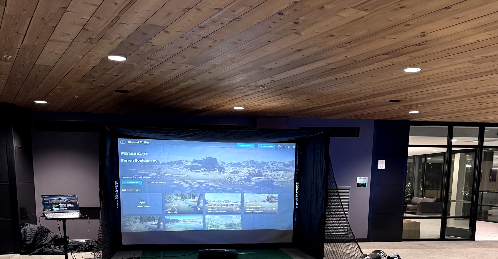 Sim2U Golf mobile golf simulator set up at a Columbus Ohio corporate event — Foresight Sports technology