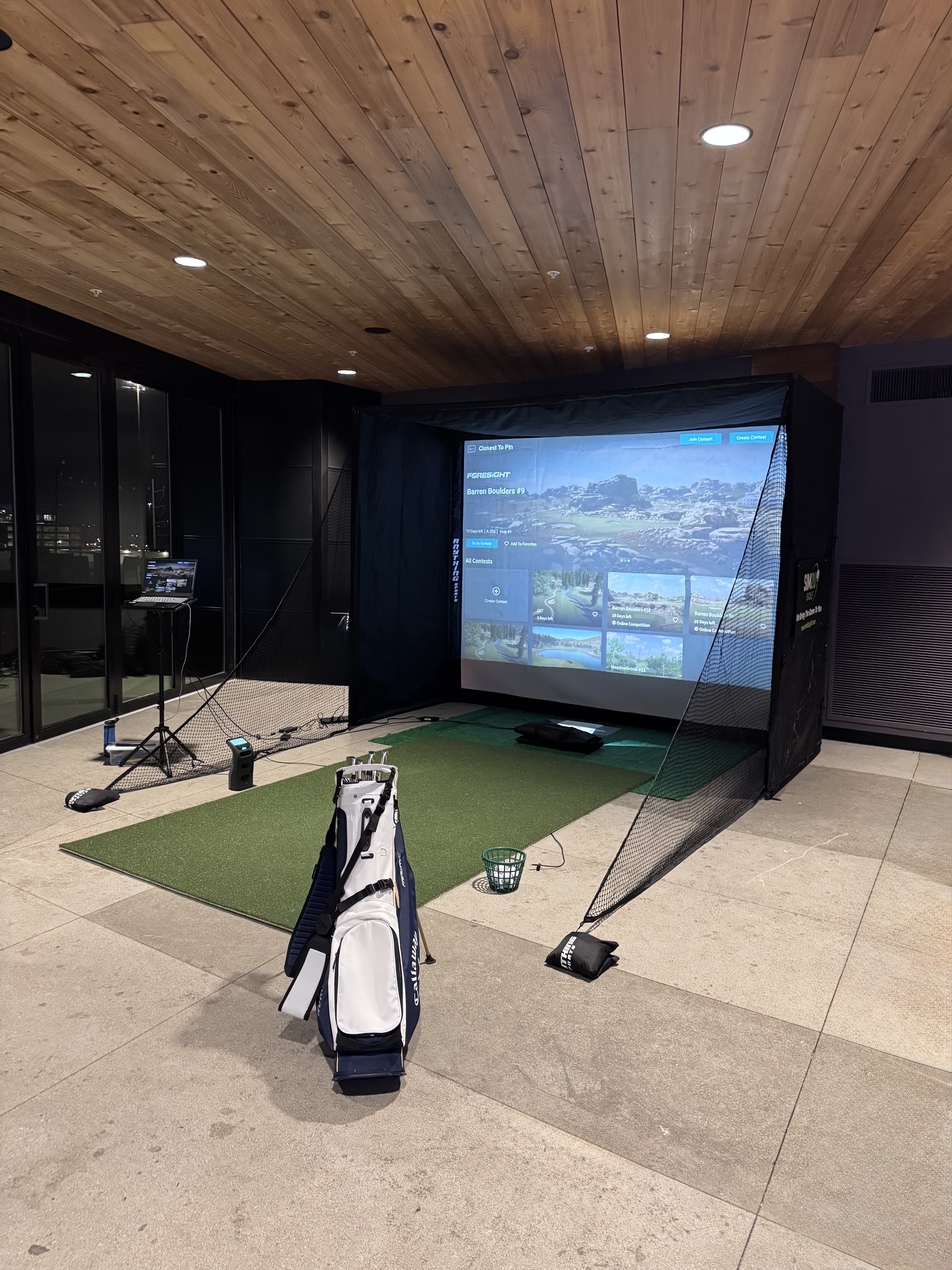 Sim2U Golf mobile golf simulator fully set up at Columbus Ohio event — Foresight Sports technology with clubs ready